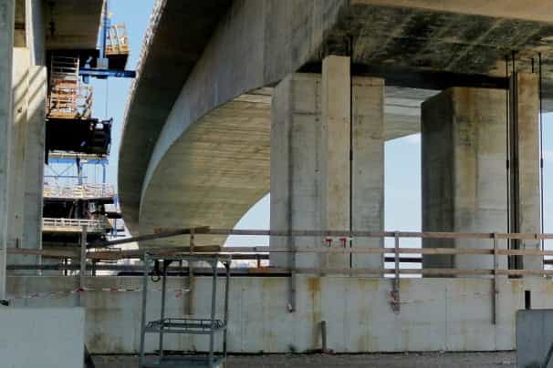 Below a bridge of a highway