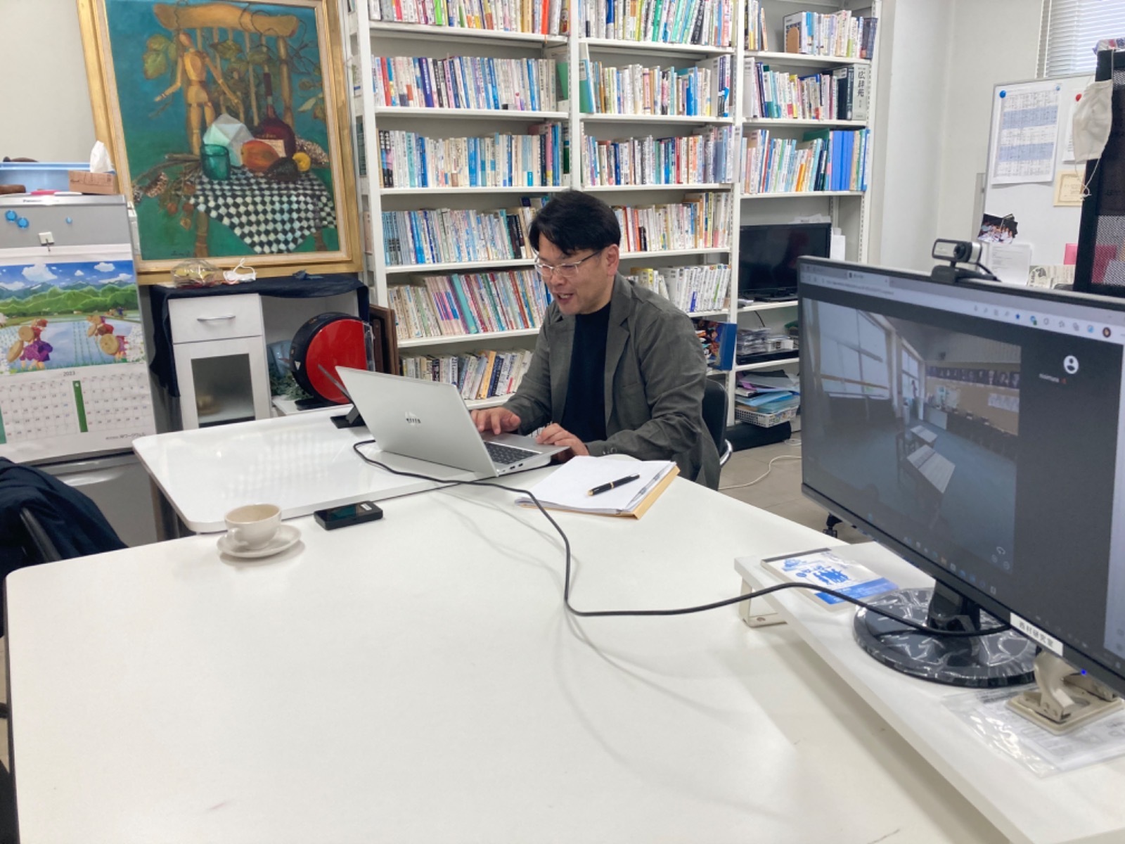 A person using a computer in a classroom